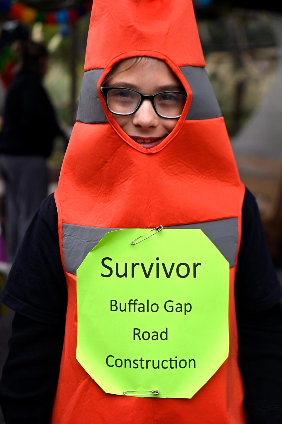 Reagan Carter, 8, of Abilene modeled her hyper-local Halloween costume referencing the Buffalo Gap Road construction project, now in its second year, during Saturday’s Boo at the Zoo.