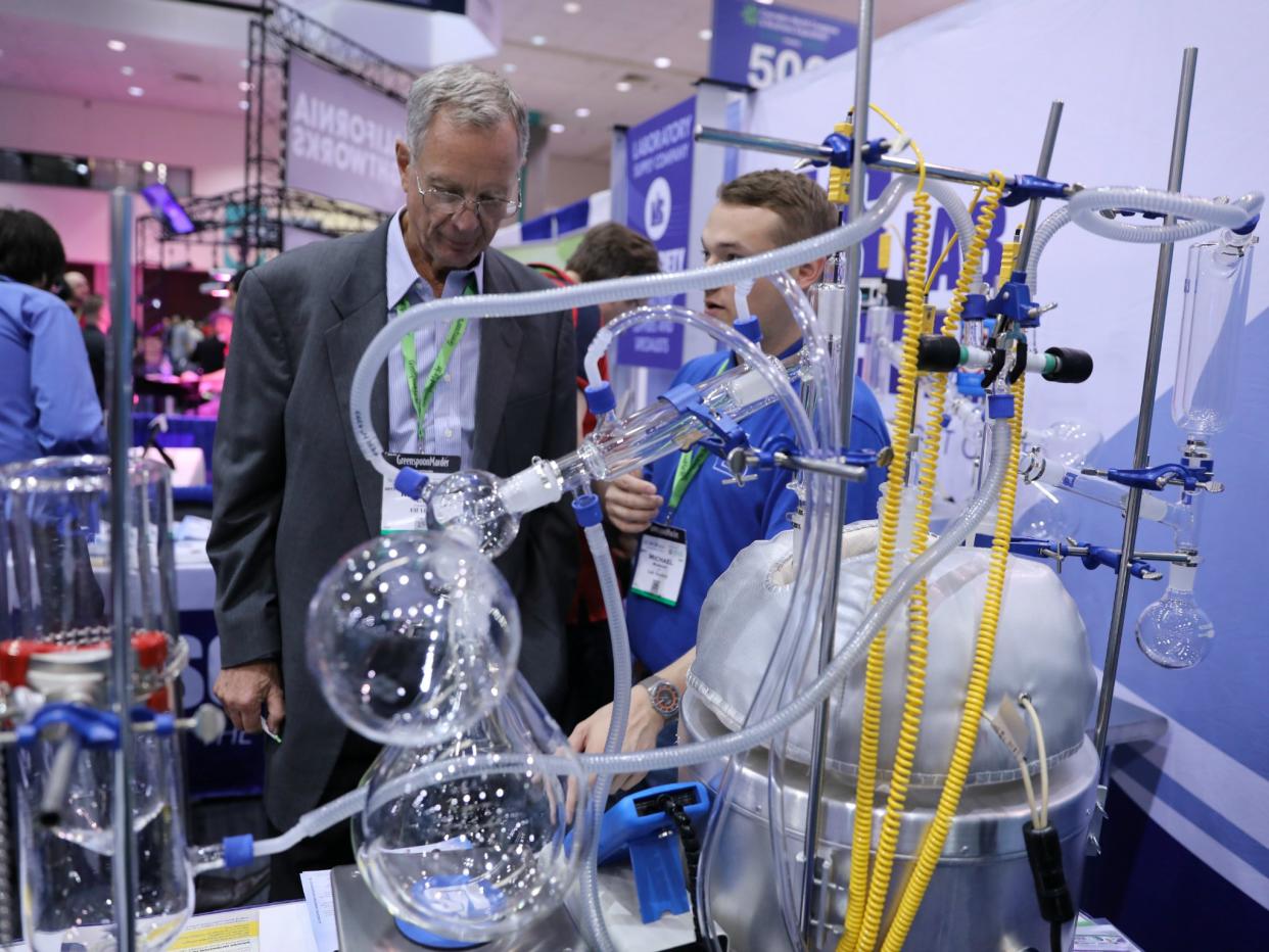 A man views a distillation system at the Cannabis World Congress & Business Exposition: Reuters