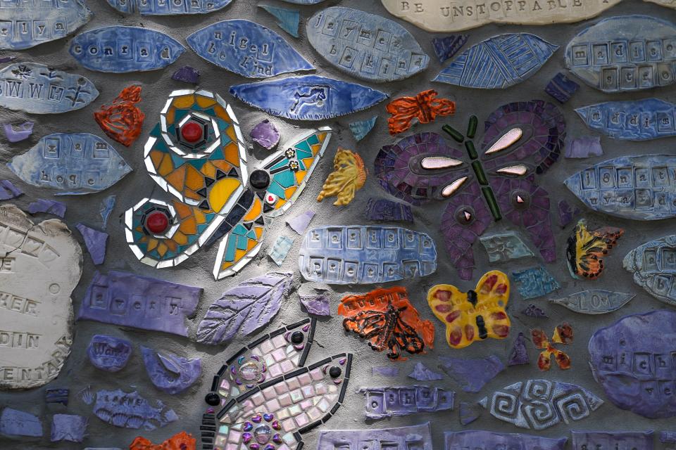 Butterflies representing the children and teachers killed in the Robb Elementary School shooting are incorporated into the mural.