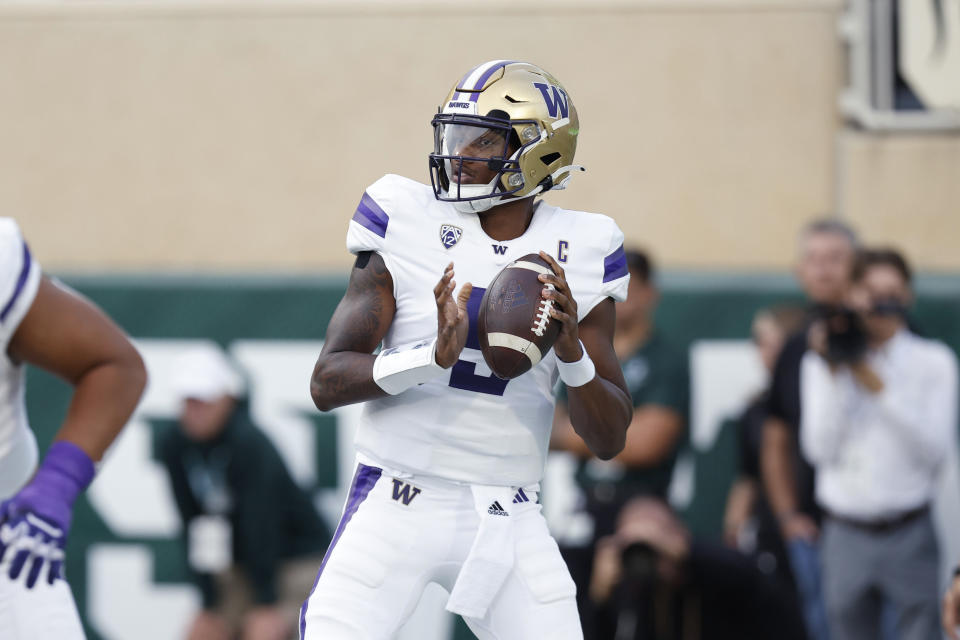 Washington quarterback Michael Penix Jr. looks to throw during the first half of an NCAA college football game against Michigan State, Saturday, Sept. 16, 2023, in East Lansing, Mich. (AP Photo/Al Goldis)