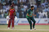 Pakistan's Harfi Rauf, right, celebrates after taking the wicket of West Indies Shamarh Brooks during the first one day international cricket match between Pakistan and West Indies at the Multan Cricket Stadium, in Multan, Pakistan, Wednesday, June 8, 2022. (AP Photo/Anjum Naveed)