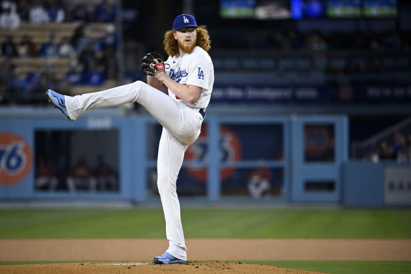 Los Angeles Dodgers starting pitcher Dustin May throws to the plate during the first inning.