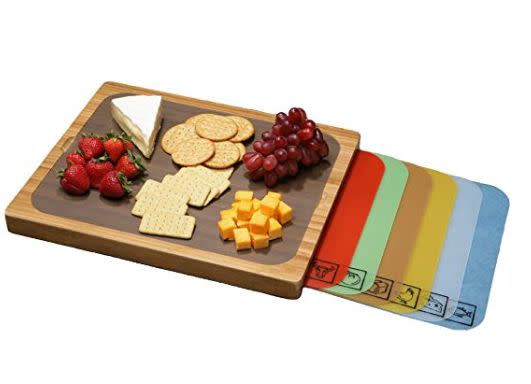 Avoid cross-contamination with these color-coded mats that fit snugly onto a bamboo board. <strong><a href="https://www.amazon.com/Seville-Classics-Cutting-Color-Coded-Flexible/dp/B001DNZI6O/ref=sr_1_4?s=home-garden&amp;ie=UTF8&amp;qid=1547575956&amp;sr=1-4&amp;keywords=cutting+boards+with+food+icons" target="_blank" rel="noopener noreferrer">Get it here. </a></strong>