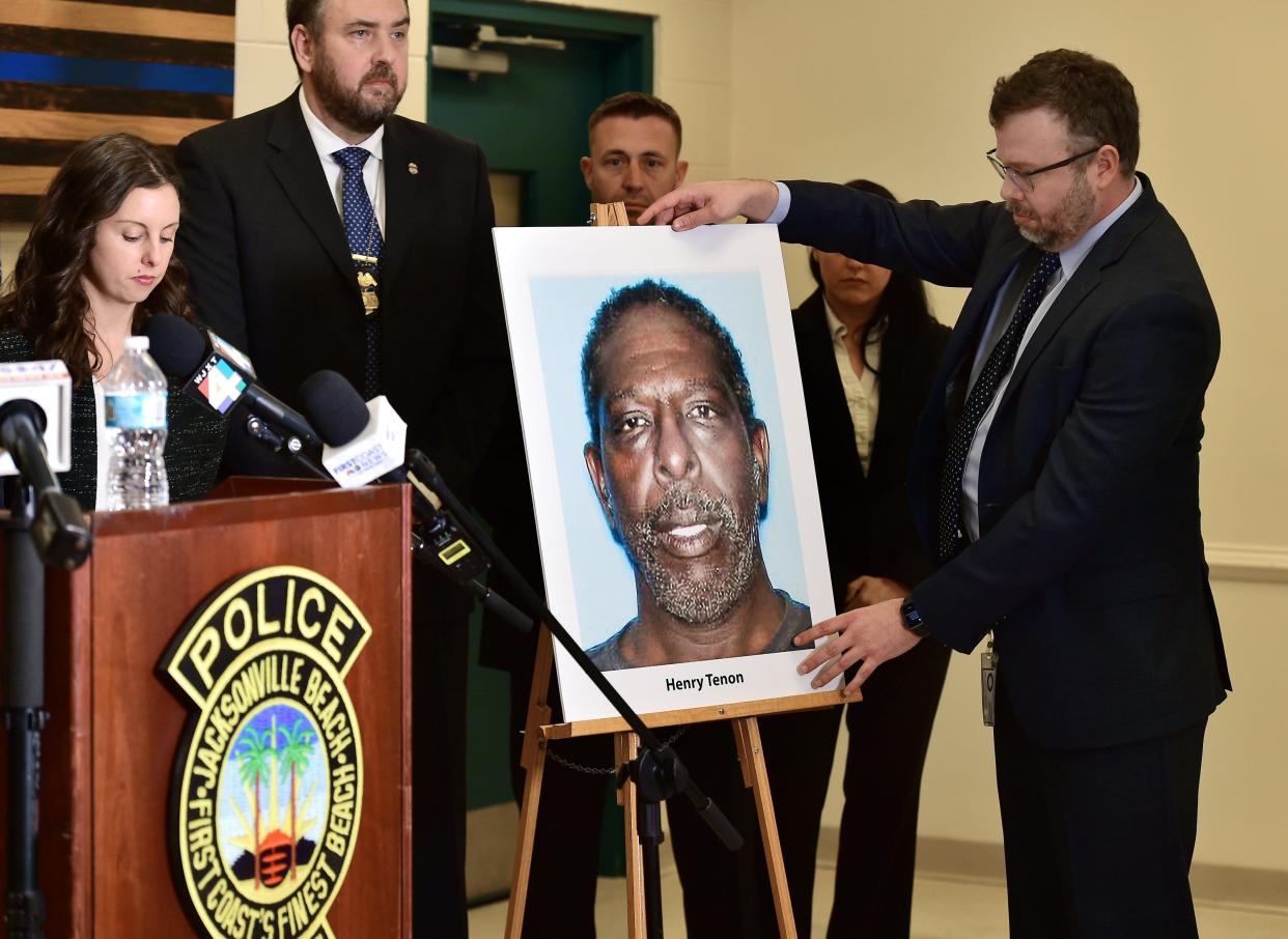 David Chapman, communications director for the State Attorney's Office, puts up a photograph of Henry Tenon during the news conference at the Jacksonville Beach Police Department on Jan. 25 announcing his arrest as a suspect in the death of Jared Bridegan.