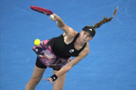 Elena Rybakina of Kazakhstan serves to Victoria Azarenka of Belarus during their semifinal match at the Australian Open tennis championship in Melbourne, Australia, Thursday, Jan. 26, 2023. (AP Photo/Dita Alangkara)