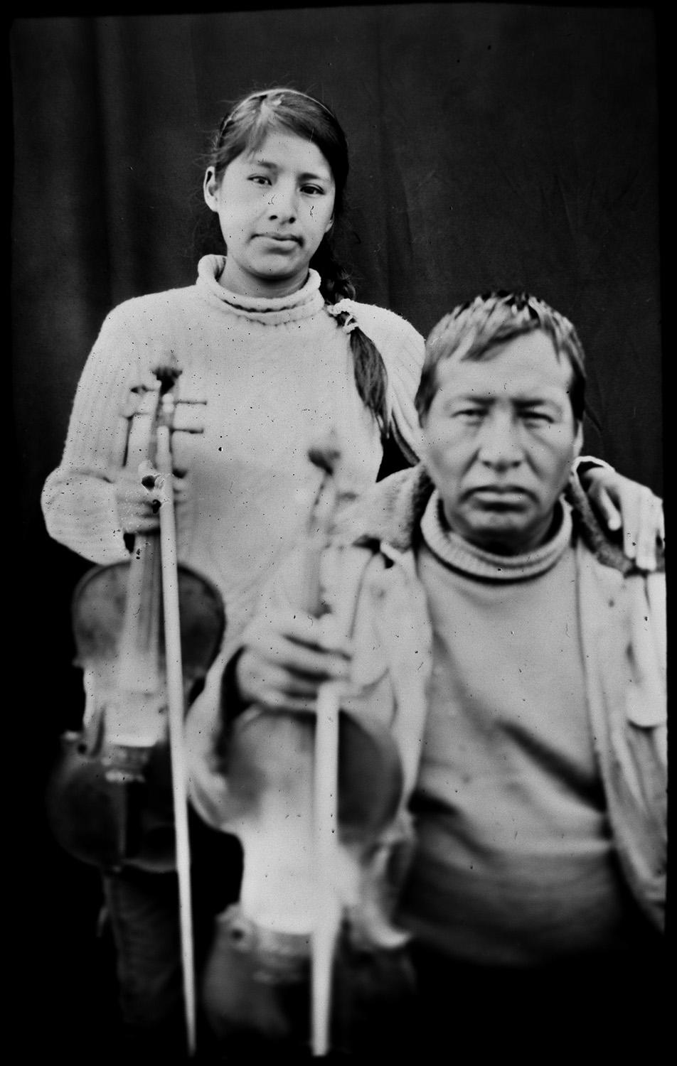 <p>Filament Wilca, 54, and his daughter Laura Wilca, 23, pose for a portrait in the Sinakara Valley, in Peru’s Cuzco region, during the Qoyllur Rit’i festival, translated from the Quechua language as Snow Star. The father and daughter are violinists representing the Quispicanchis nation. (Photo: Rodrigo Abd/AP) </p>