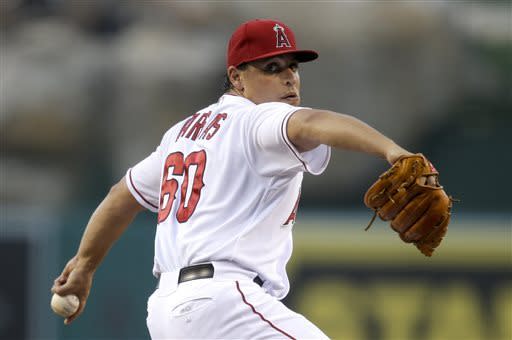 Los Angeles Angels starting pitcher Jason Vargas throws against the Kansas City Royals during the first inning of a baseball game in Anaheim, Calif., Tuesday, May 14, 2013. (AP Photo/Jae C. Hong)