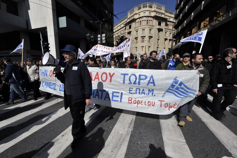 Thousands of protesters march in central Athens during a 24-hour general strike on February 20, 2013. The nationwide strike -- the first general work stoppage in Greece this year -- forced airport authorities to scrap or reschedule dozens of flights while hospitals operated on reduced staffing