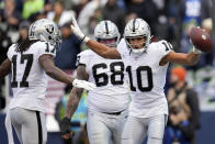 Las Vegas Raiders wide receiver Mack Hollins (10) celebrates his touchdown catch during the first half of an NFL football game against the Seattle Seahawks Sunday, Nov. 27, 2022, in Seattle. (AP Photo/Gregory Bull)