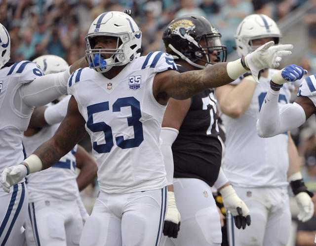 Indianapolis Colts quarterback Andrew Luck (12) scrambles as New York Jets  defensive end Leonard Williams (92) chases him during the first half of an  NFL football game, Sunday, Oct. 14, 2018, in