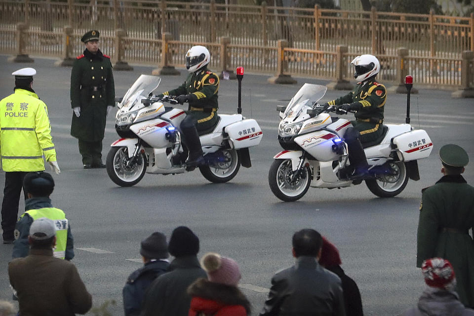 Chinese paramilitary police on motorcycles escort a motorcade believed to be carrying North Korean leader Kim Jong Un passes along a street in Beijing, Wednesday, Jan. 9, 2019. North Korean state media reported Tuesday that Kim is making a four-day trip to China in what's likely an effort by him to coordinate with his only major ally ahead of a summit with U.S. President Donald Trump that could happen early this year. (AP Photo/Mark Schiefelbein)