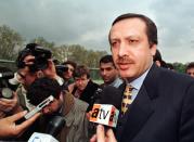 <p>Istanbul Mayor Tayyip Erdogan is mobbed by journalists while he inspects a public park in the north of Istanbul April 21, 1998. The state security court in the southeastern Turkish city of Diyarbakir sentenced mayor Erdogan, one of the most prominent Islamists, to 10 months in jail for “enciting hatred” in an address to Islamists supporters last year in the nearby town of Siirt. Erdogan dismisssed the verdict and said his lawyers had launched an appeal. (Fatih Saribas/Reuters) </p>