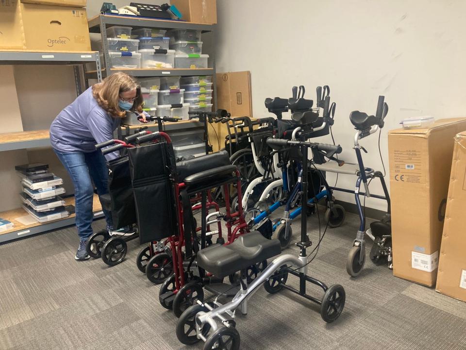 Jane Teeter, who is in charge of the Reutilization program at the Illinois Assistive Technology Program, looks over wheelchairs and rollators that have been donated to IATP, which helps persons with disabilities with adaptive technology. IATP is moving into to the former Vibra Hospital at 701 N. Walnut St. by late this summer.