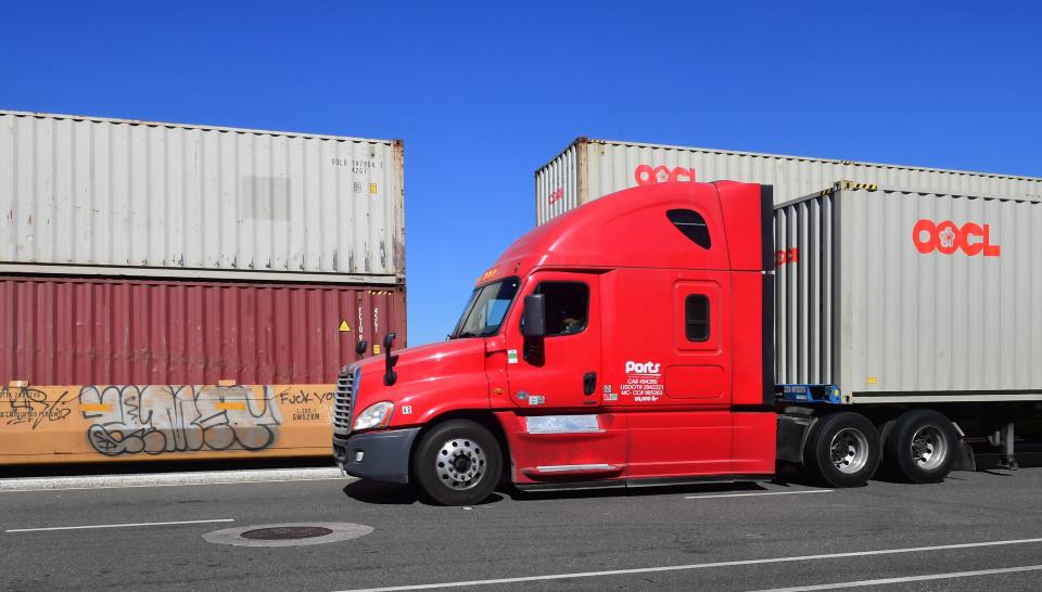 A container truck arrives at the Long Beach Container Terminal at the Port of Long Beach on November 12, 2021 in Long Beach, California. - The shortage of truck drivers is exacerbating the supply chain crisis in the United States, with a report released last month by the American Trucking Association estimating the industry is short 80,000 drivers, a figure which can double by 2030 as more retire. (Photo by Frederic J. BROWN / AFP) (Photo by FREDERIC J. BROWN/AFP via Getty Images)