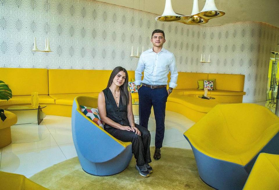 Newlyweds Santiago Rodriguez and Alice Teodoro in a lounge at the Paraiso Bay Views in Edgewater, where he bought a one-bedroom condo.