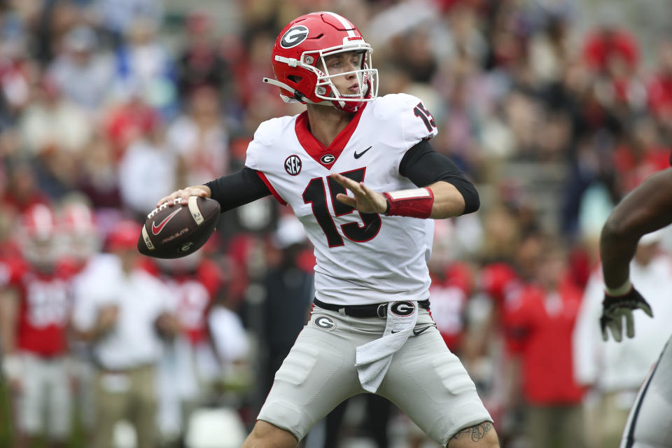 FILE - Georgia quarterback Carson Beck (15) throws in the first half of Georgia's spring NCAA college football game, Saturday, April 16, 2022, in Athens, Ga. Coach Kirby Smart has made it clear that Carson Beck is the quarterback to beat. (AP Photo/Brett Davis, File)
