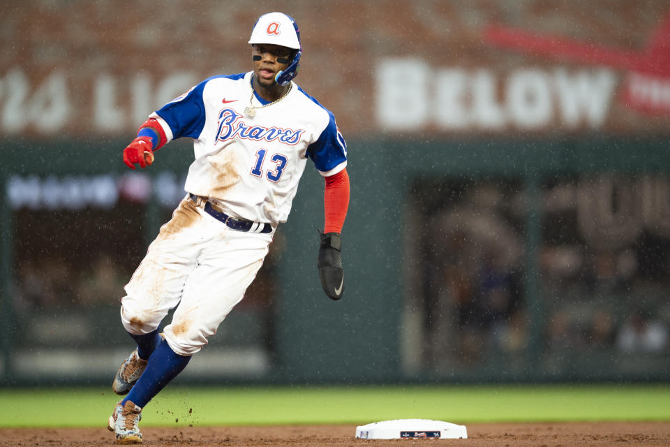 Atlanta Braves' Ronald Acuna Jr. (13) rounds second base in the first inning of a baseball game against the Milwaukee Brewers, Saturday, May 7, 2022, in Atlanta. (AP Photo/Hakim Wright Sr)