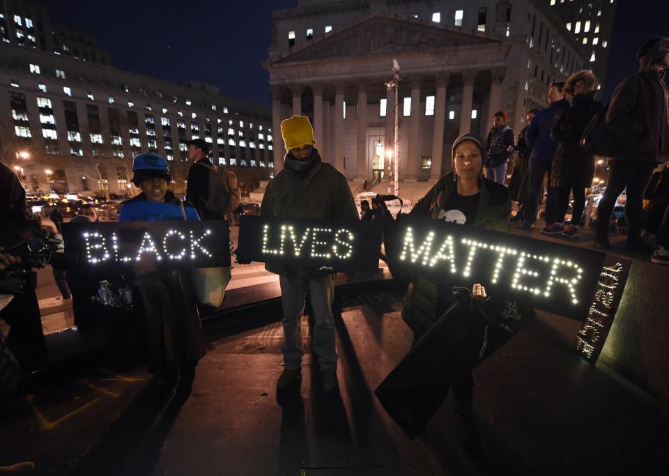 <span class="caption">Protesters demonstrate on Dec. 4, 2014, against the chokehold death of Eric Garner by a white police officer in New York City.</span> <span class="attribution"><a class="link " href="https://www.gettyimages.com/detail/news-photo/protesters-stand-in-foley-square-in-new-york-city-on-news-photo/459960058?adppopup=true" rel="nofollow noopener" target="_blank" data-ylk="slk:Timothy A. Clary/AFP via Getty Images;elm:context_link;itc:0;sec:content-canvas">Timothy A. Clary/AFP via Getty Images</a></span>