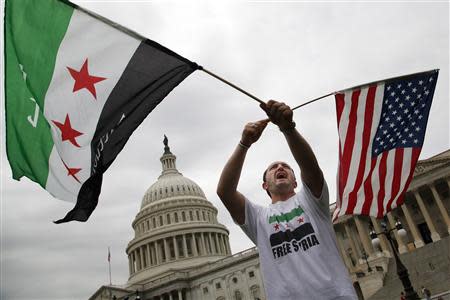 Jehad Sibai, a physician from Michigan, joins a group of Syrian-Americans rallying in favor of proposed U.S. military action, outside the U.S. Capitol in Washington, September 9, 2013. REUTERS/Jonathan Ernst