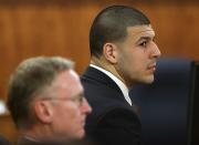 Former National Football League player Aaron Hernandez (R) waits for a verdict in his trial at Bristol County Superior Court in Fall River with his attorney Charles Rankin (L) in Fall River, Massachusetts April 14, 2015. Hernandez, 25, a former tight end for the New England Patriots, is accused of fatally shooting semiprofessional football player Odin Lloyd in an industrial park near Hernandez's Massachusetts home in June 2013. REUTERS/David L. Ryan/Pool