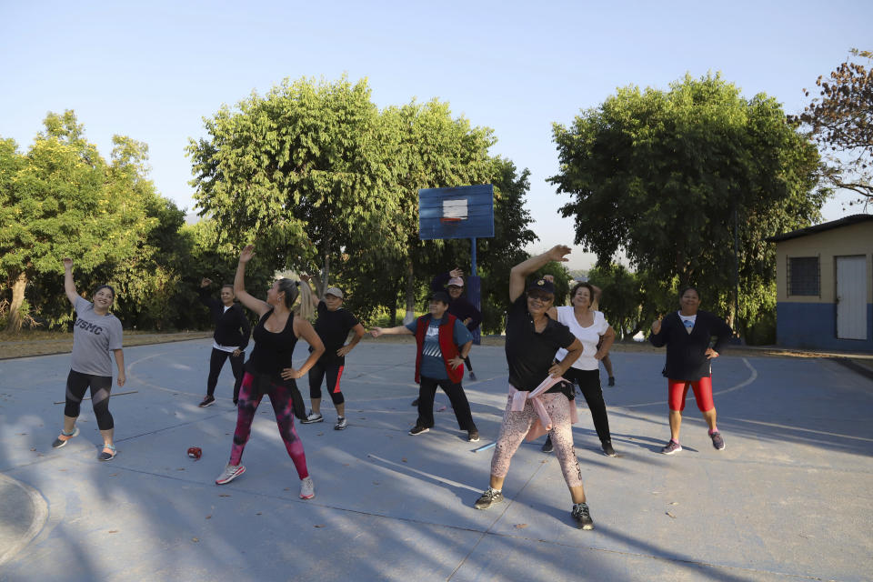 Women exercise in a park in the Santa Marta Community, a territory under the control of the Mara Salvatrucha gang, in San Salvador, El Salvador, Tuesday, Feb. 28, 2023. This kind of recreation would have been unthinkable before the government suspended constitutional rights and started an all out offensive on the gangs one year ago. (AP Photo/Salvador Melendez)