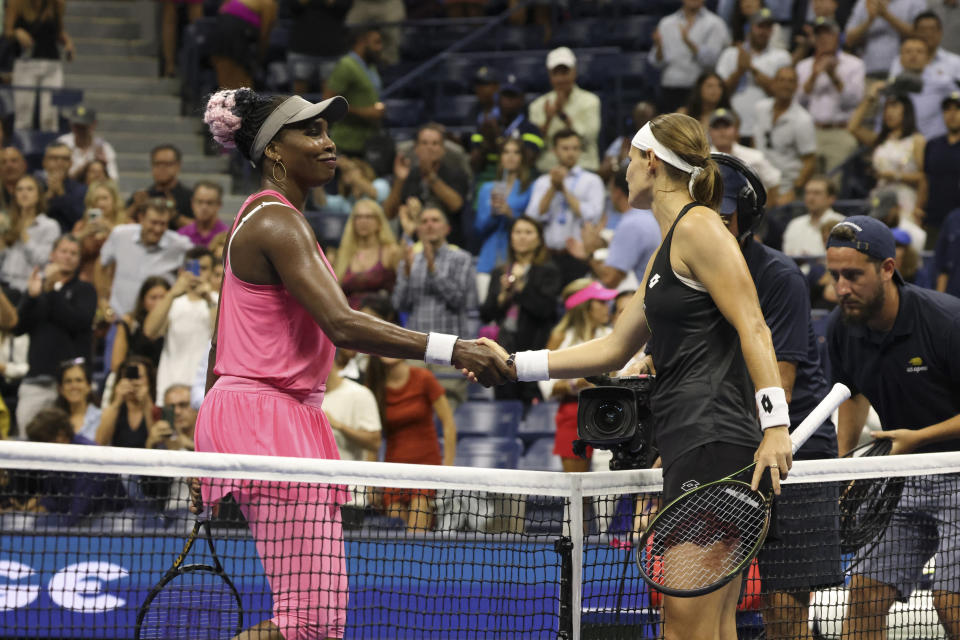 Greet Minnen, of Belgium, right, shakes hands with Venus Williams, of the United States, after winning their match during the first round of the U.S. Open tennis championships, Tuesday, Aug. 29, 2023, in New York. (AP Photo/Jason DeCrow)