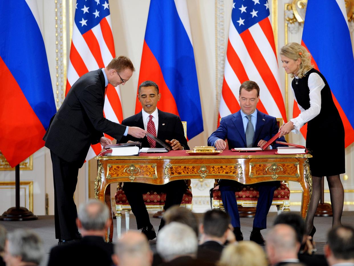 US President Barack Obama (L) and Russian President Dmitry Medvedev sign the new Strategic Arms Reduction Treaty (START) in Prague on April 8, 2010 (AFP via Getty Images)