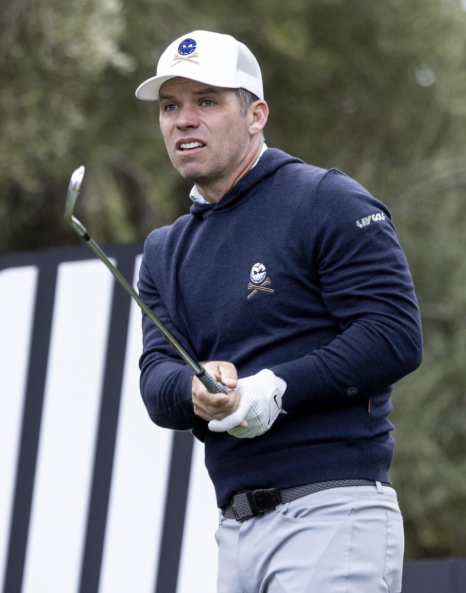 Paul Casey watches his shot from the 12th tee during the first round of LIV Golf Las Vegas at Las Vegas Country Club on Thursday, Feb. 8, 2024, in Las Vegas. (Chris Trotman/LIV Golf via AP)