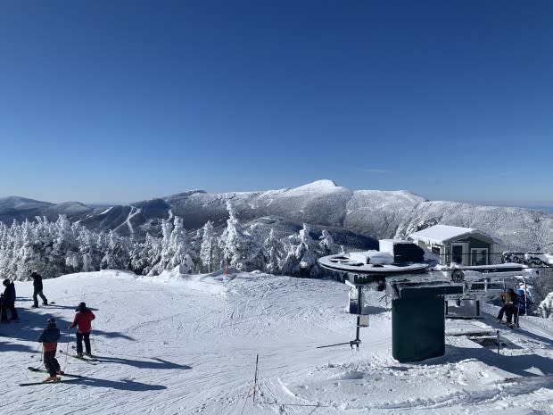 <em>Stowe (trails in the background) as seen from the top of Madonna Mountain at Smuggler's Notch Resort. Credit: Matt Lorelli/Powder Magazine</em>