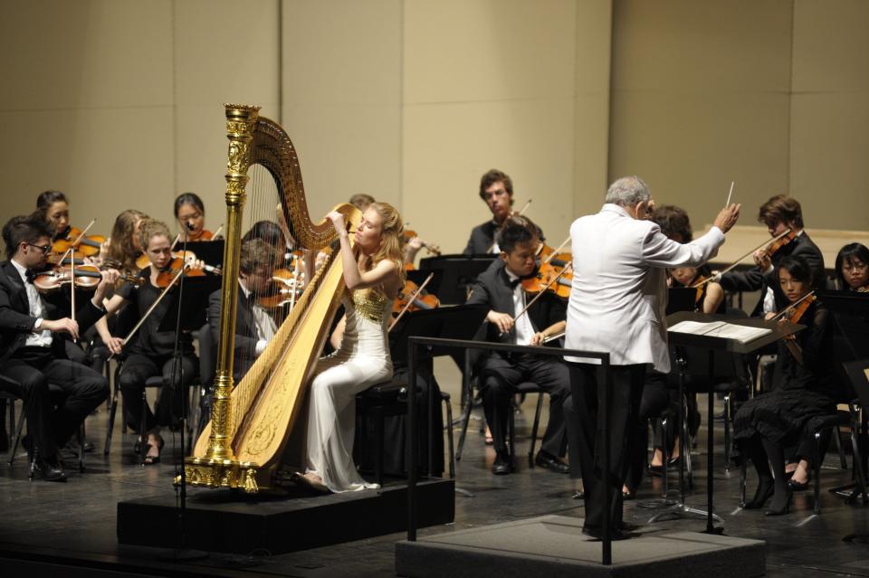 A competitor takes center stage at the 2010 International Harp Competition on the Indiana University campus. An upcoming benefit concert this weekend will raise money for the USA International Harp Competition.