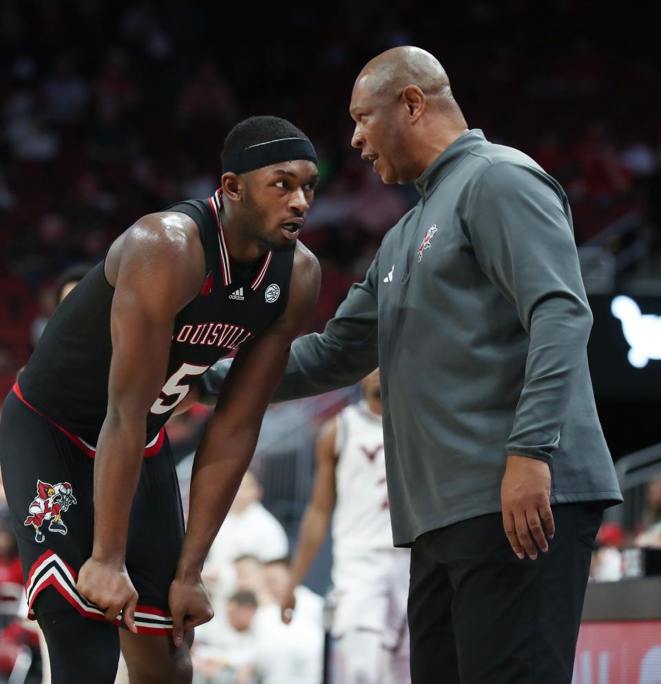 Louisville basketball head coach Kenny Payne instructs Brandon Huntley-Hatfield (5) against Virginia Tech at the KFC Yum! Center in Louisville, Ky. on Mar. 5, 2024.