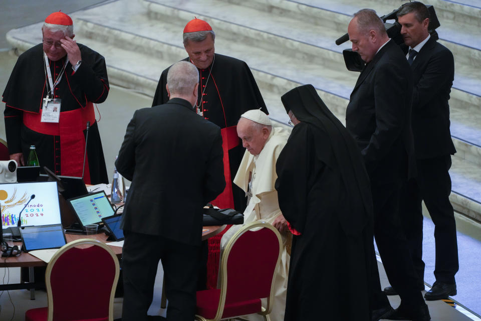 Pope Francis arrives for the opening session of the 16th General Assembly of the Synod of Bishops arrive in the Paul VI Hall at The Vatican, Wednesday, Oct. 4, 2023. Francis is convening a global gathering of bishops and laypeople to discuss the future of the Catholic Church, including some hot-button issues that have previously been considered off the table for discussion. Key agenda items include women's role in the church, welcoming LGBTQ+ Catholics, and how bishops exercise authority. For the first time, women and laypeople can vote on specific proposals alongside bishops. (AP Photo/Gregorio Borgia)