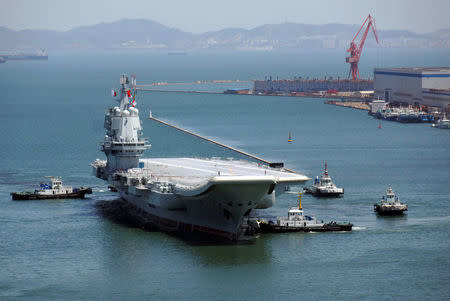 China's first domestically developed aircraft carrier is seen at a port in Dalian after completing its first sea trials, in Liaoning province, China May 18, 2018. REUTERS/Stringer