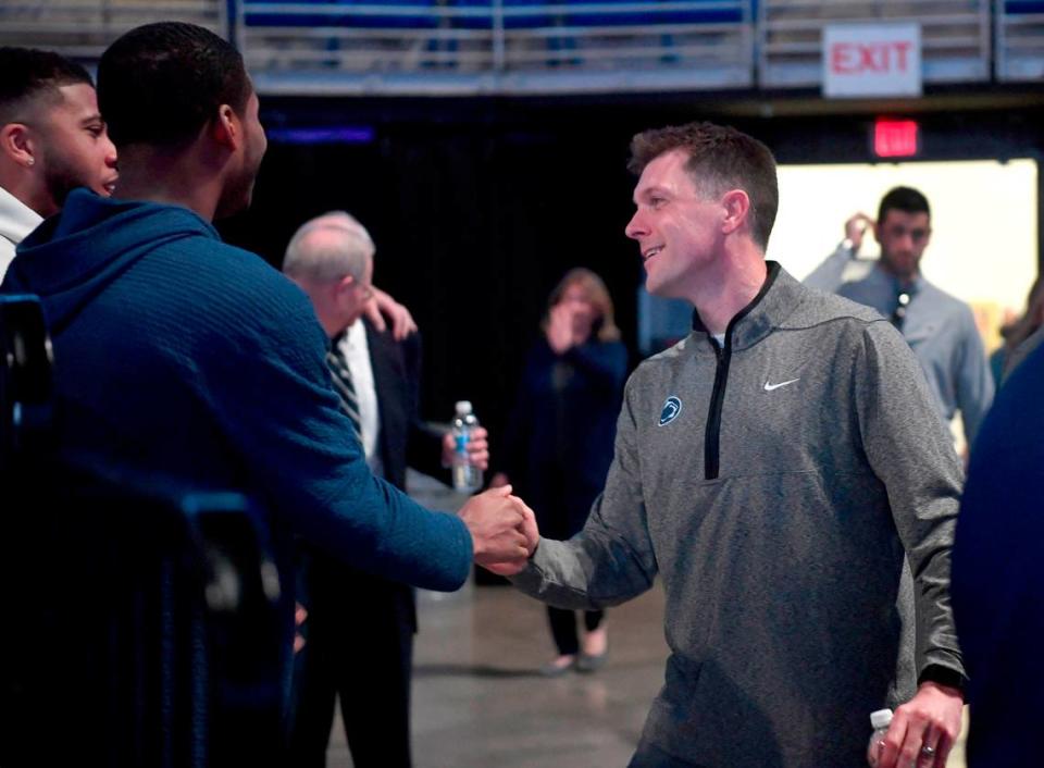 Penn State men’s basketball assistant Joe Crispin greets basketball players as he arrives for the press conference for new head coach Mike Rhoades on Thursday, March 30, 2023.