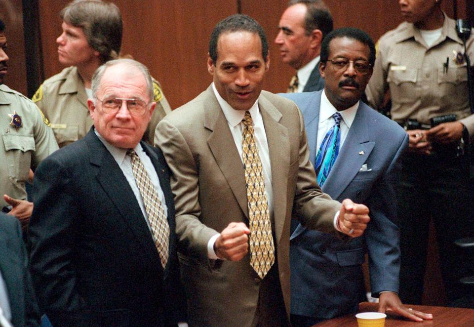 <p>FILE - In this Oct. 3, 1995, file photo, O.J. Simpson reacts as he is found not guilty in the death of his ex-wife Nicole Brown Simpson and her friend Ron Goldman in Los Angeles. Defense attorneys F. Lee Bailey, left, and Johnnie L. Cochran Jr. stand with him. Cochran, Simpson's flamboyant lead attorney, died of brain cancer in 2005 at 68. His refrain to jurors that 