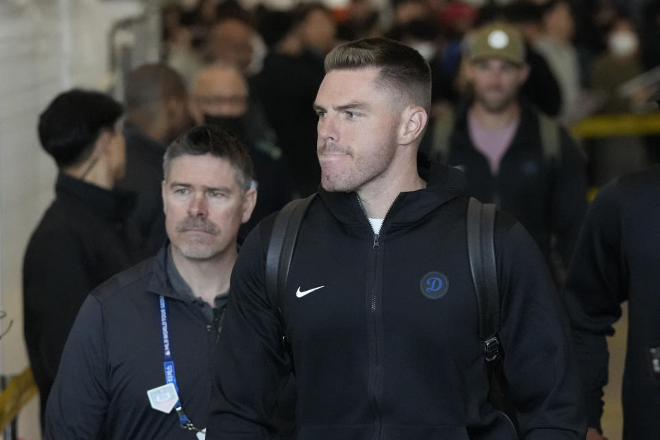 CORRECTS DATE - Los Angeles Dodgers first baseman Freddie Freeman walks through a terminal during the baseball team's arrival at Incheon International Airport, Friday, March 15, 2024, in Incheon, South Korea, ahead of the team's baseball series against the San Diego Padres. (AP Photo/Lee Jin-man)