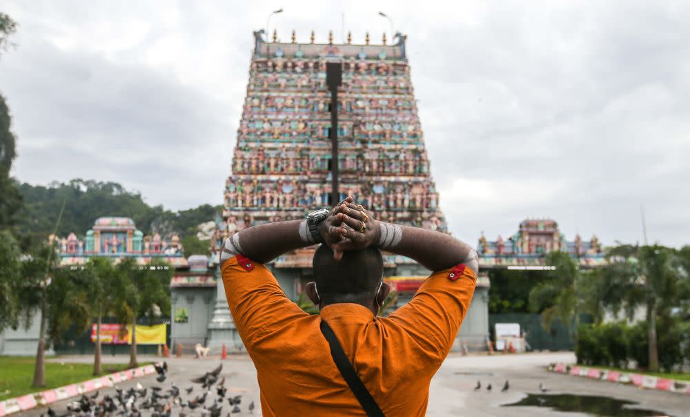 A Hindu devotee prays at the Kallumalai Arulmigu Subramaniyar Temple in Ipoh during Thaipusam January 28, 2021. — Picture by Farhan Najib