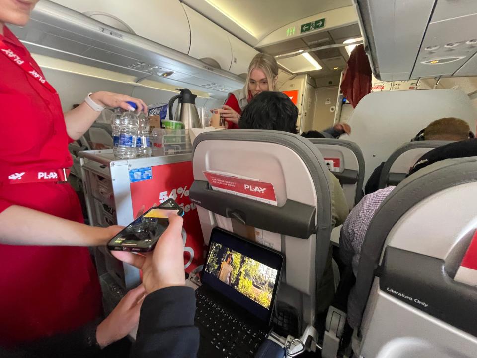 Using contactless card to pay for in-flight snacks on PLAY flight Asia London Palomba PLAY Airlines review