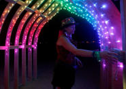 <p>Erin Searcy explores an art installation as approximately 70,000 people from all over the world gather for the 30th annual Burning Man arts and music festival in the Black Rock Desert of Nevada, Aug. 29, 2016. (REUTERS/Jim Urquhart)</p>