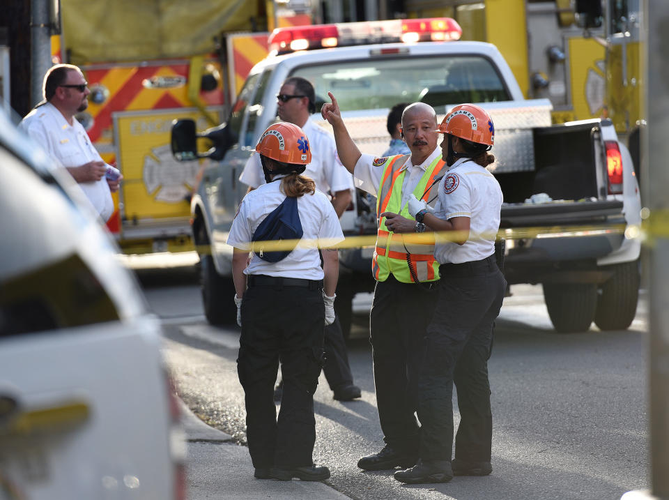 Paramedics prepare to go into the building