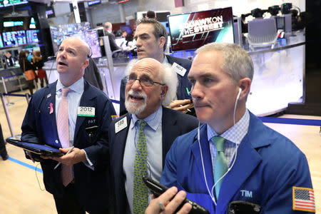 Traders work on the floor of the New York Stock Exchange (NYSE) in New York, U.S., February 13, 2019. REUTERS/Brendan McDermid