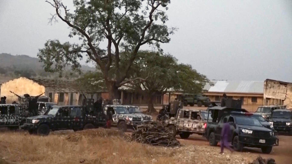 In this screen grab taken from video, Nigerian Army vehicles are parked near the school were children were kidnapped in Kuriga, Kaduna State, Thursday, March. 7, 2024. Gunmen attacked a school in Nigeria's northwest region Thursday morning and abducted at least 287 students, the headteacher told authorities, marking the second mass abduction in the West African nation in less than a week. (AP Video)