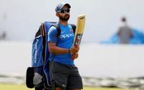 Cricket - Sri Lanka v India - India Team's Practice Session - Galle, Sri Lanka - July 25, 2017 - India's cricketer Ajinkya Rahane inspects his bat as he arrives ahead of their first test match. REUTERS/Dinuka Liyanawatte