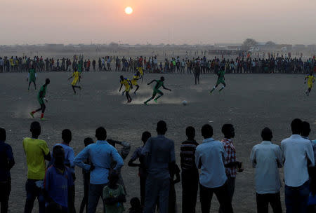 People watch a football match in the United Nations Mission in South Sudan (UNMISS) Protection of Civilian site (CoP), near Bentiu, northern South Sudan, February 6, 2017. REUTERS/Siegfried Modola