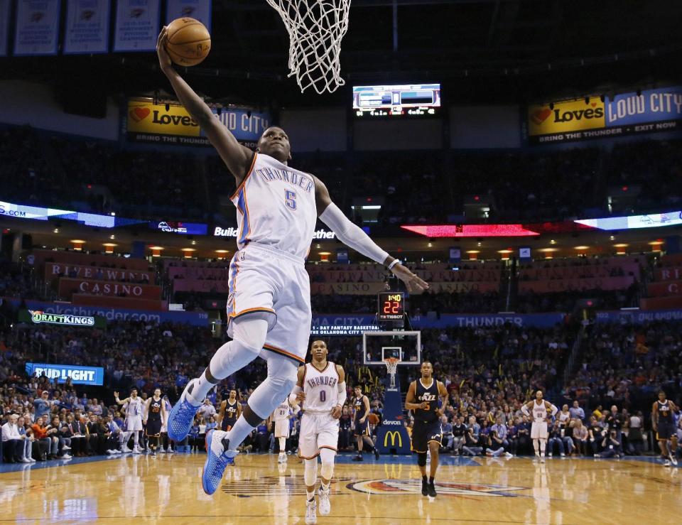 Oklahoma City Thunder guard Victor Oladipo (5) goes up for a dunk in the second quarter of an NBA basketball game against the Utah Jazz in Oklahoma City, Saturday, March 11, 2017. Oklahoma City won 112-104. (AP Photo/Sue Ogrocki)