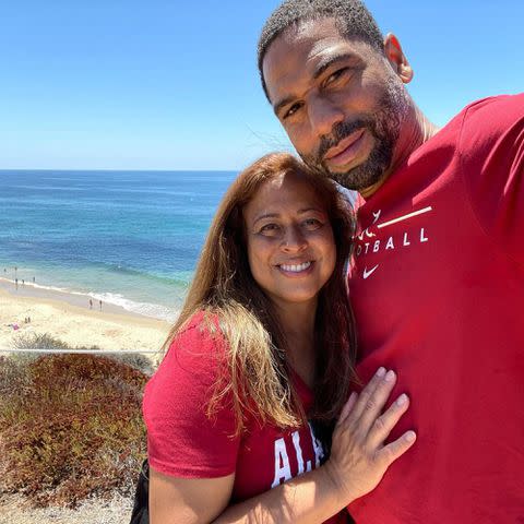 <p>Craig Young Instagram</p> Bryce Young's parents Julie and Craig Young pose for a selfie near the water.