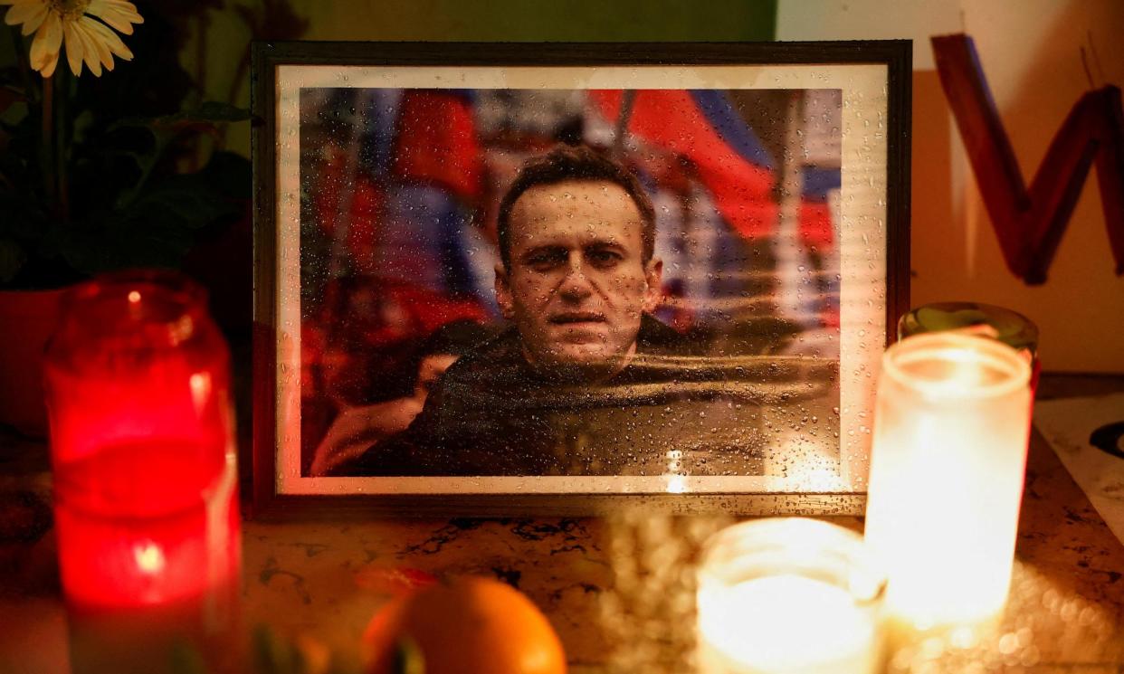 <span>A candlelit vigil for Alexei Navalny in Paris. It remains unclear whether the authorities will allow mourners to gather freely at his funeral in Moscow on Friday.</span><span>Photograph: Benoît Tessier/Reuters</span>