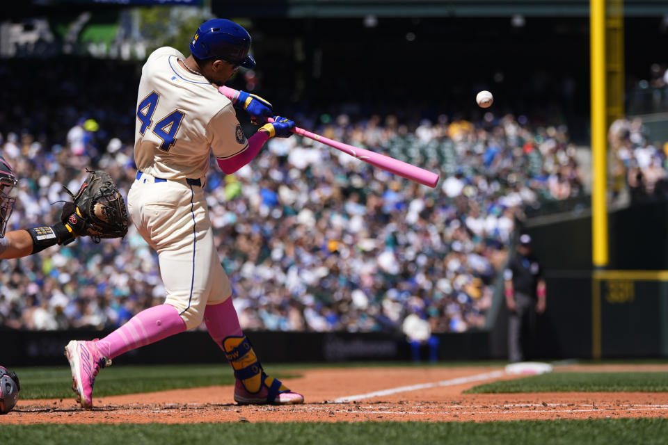 Seattle Mariners' Julio Rodríguez hits a double against the Oakland Athletics during the fifth inning of a baseball game Sunday, May 12, 2024, in Seattle. (AP Photo/Lindsey Wasson)
