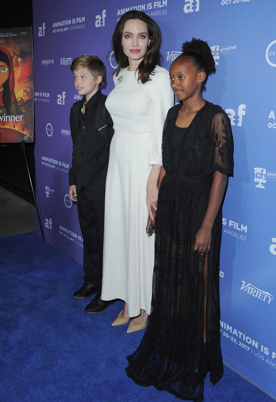 The 42-year-old actress was all smiles at the premiere of 'The Breadwinner,' holding hands with her two oldest daughters.