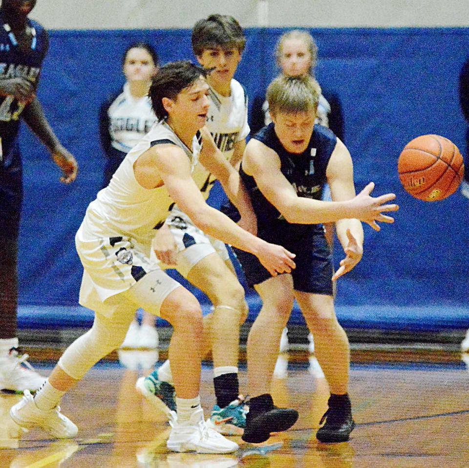 Great Plains Lutheran's Micah Holien knocks the ball away from Sioux Falls Lutheran's Kaiden Fjelstad during their high school boys basketball game on Friday, Jan. 20, 2023 in Watertown. Looking on is GPL's Hayden Karli.